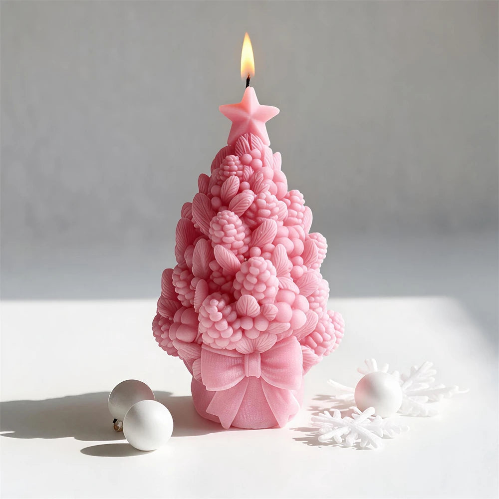 Botanical Christmas tree candle with large decorative bow at the base