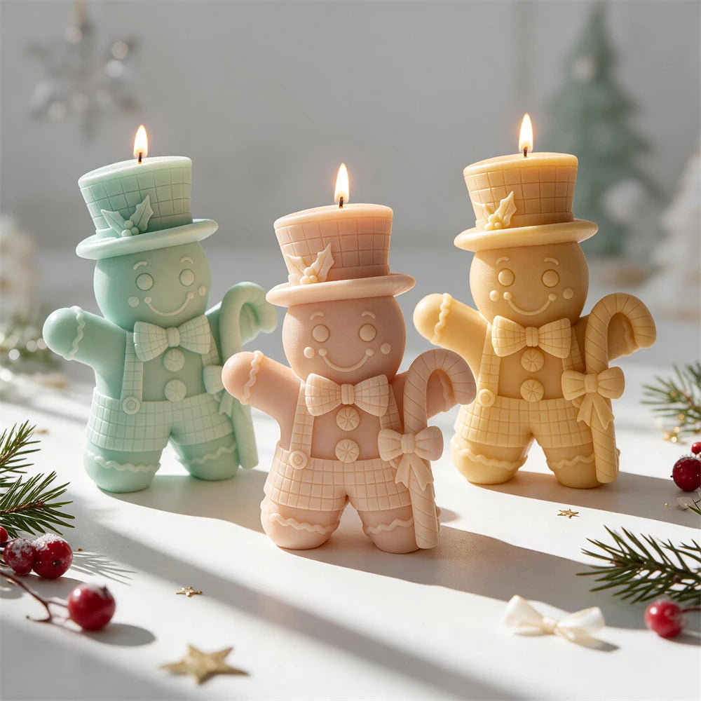 Top hat Gingerbread Man candle holding a large candy cane