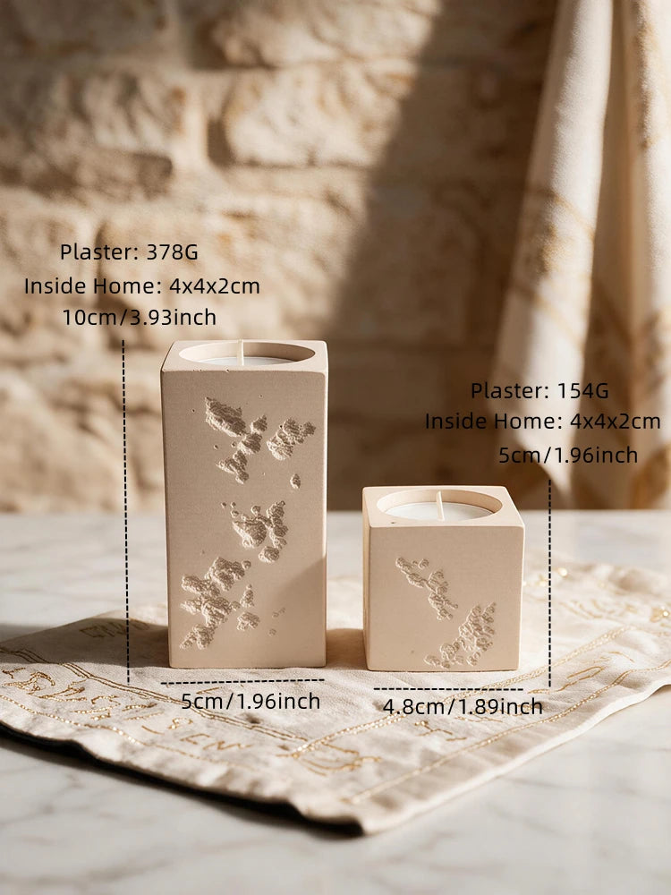 Tall and short square tea light holders with distressed stone-style texture