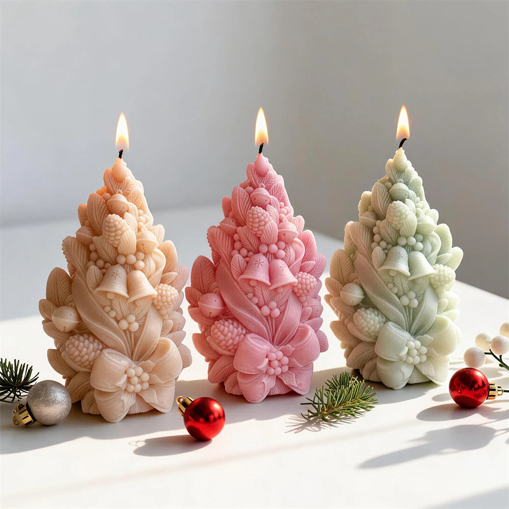 Pinecone bell Christmas tree candles with botanical foliage and ribbon bows