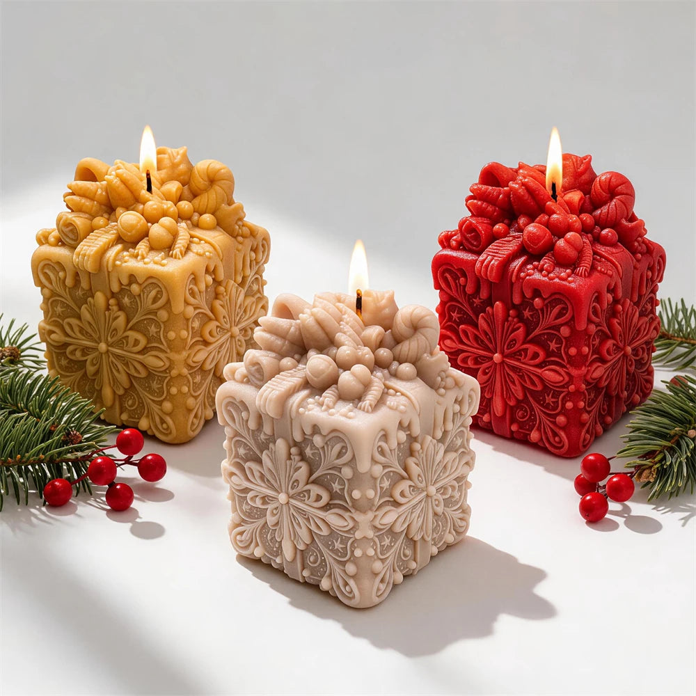 Snowflake gift box candles with decorative ribbon bows for Christmas