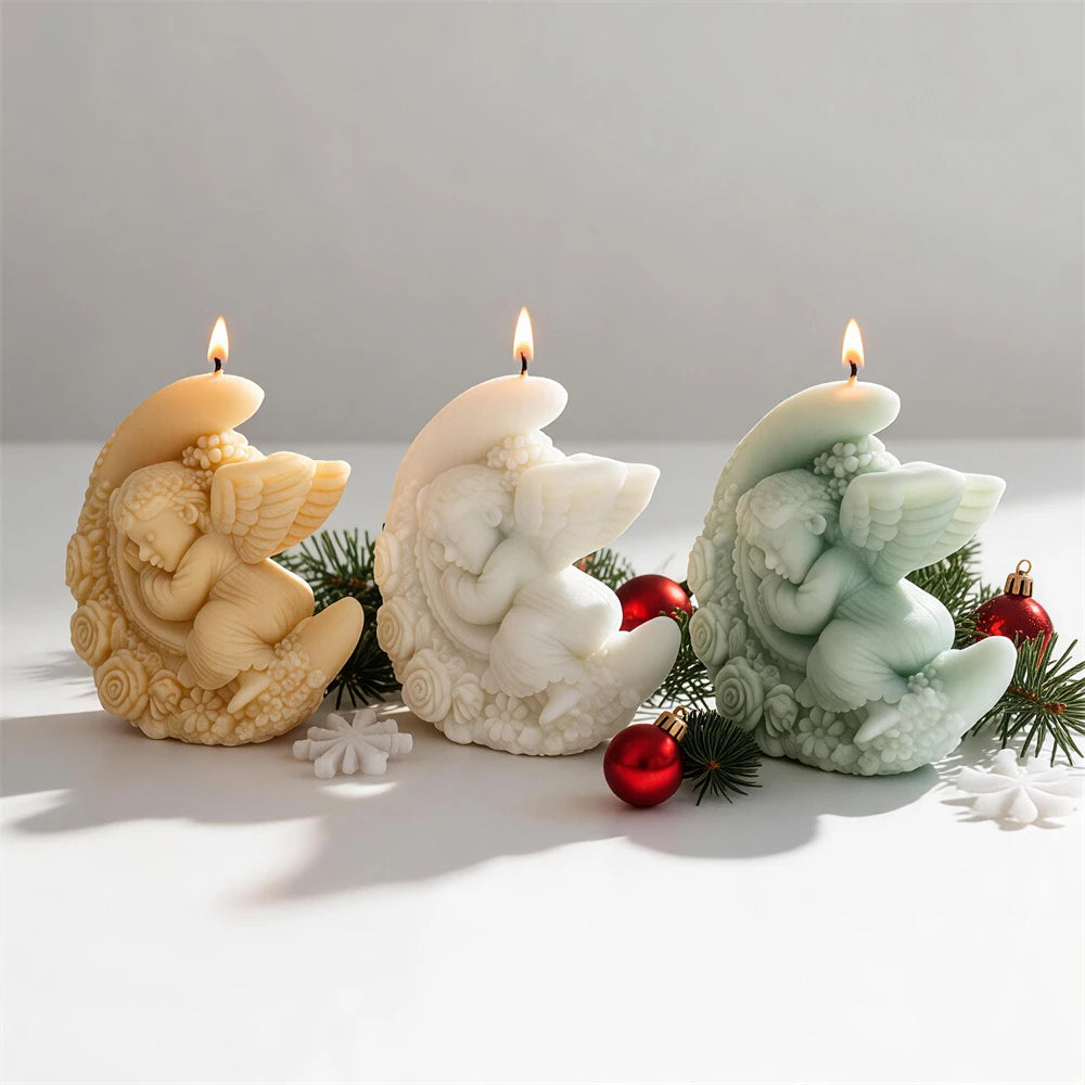 Winged angel resting inside a floral crescent moon candle design