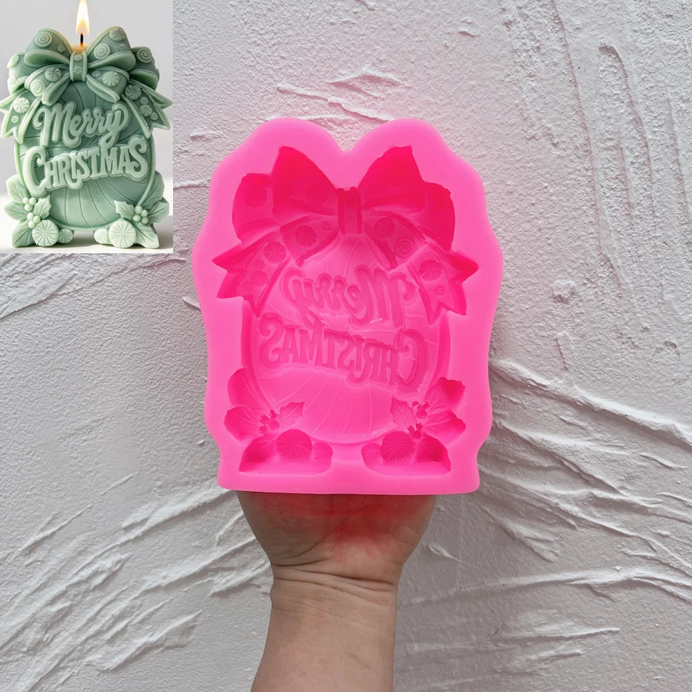 Merry Christmas silicone candle mold with large ribbon bow and holly details
