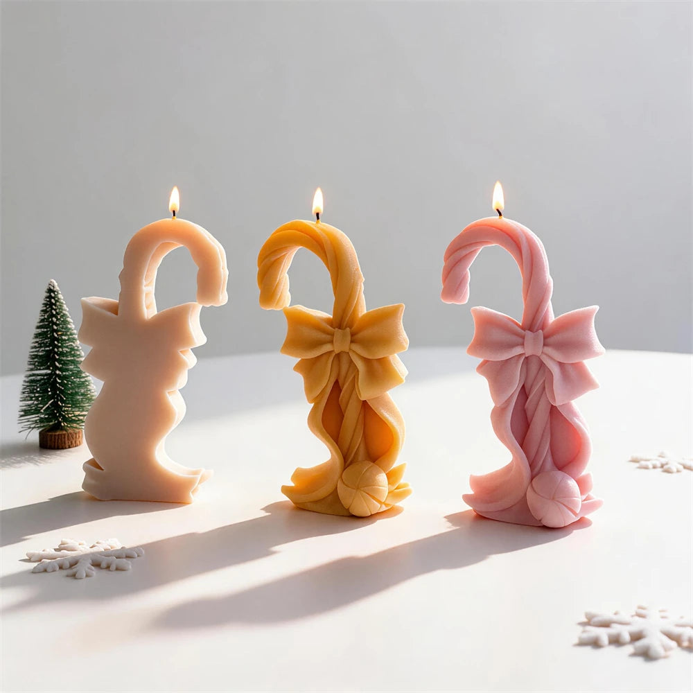 Christmas candy cane candle with oversized bow and curled ribbon details