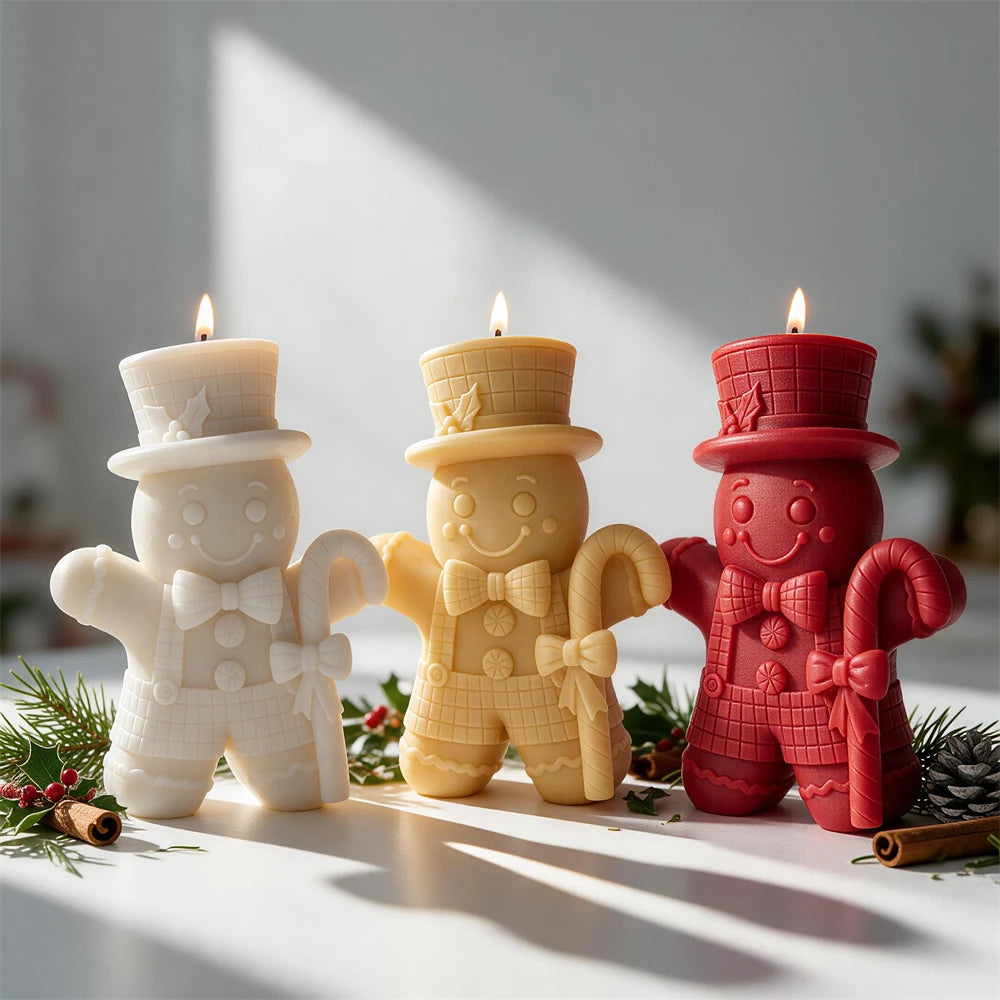 Top hat Gingerbread Man candle holding a large candy cane