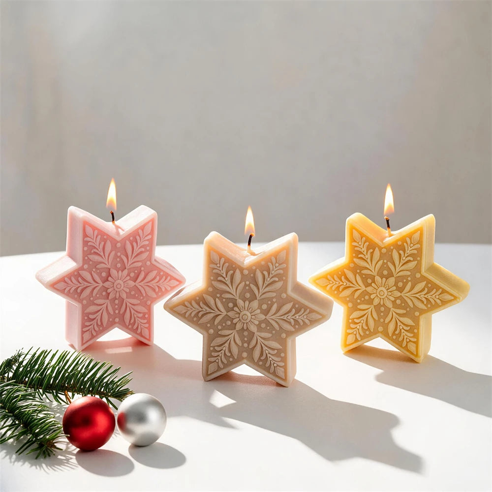 Ornate snowflake star candles with detailed six-point winter patterns