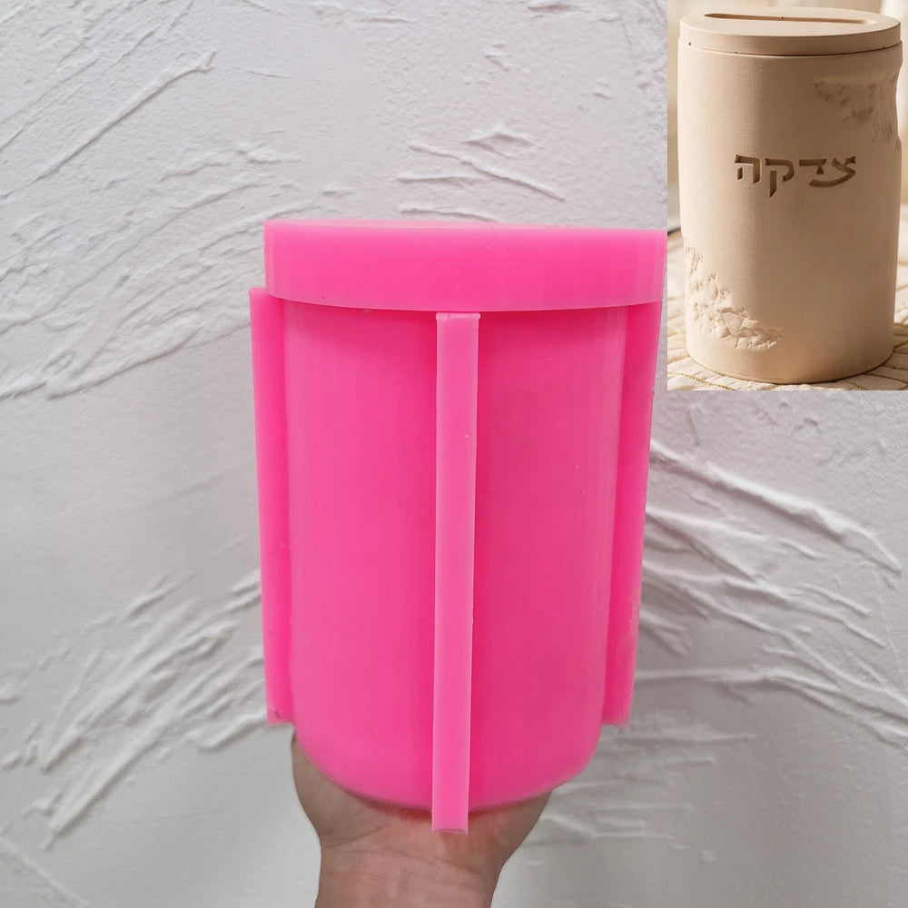Pink silicone mold for cylindrical Tzedakah charity money box casting