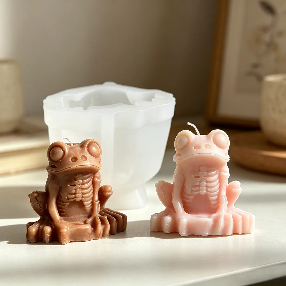 Gothic frog candle with large eyes skeletal torso and long fingers