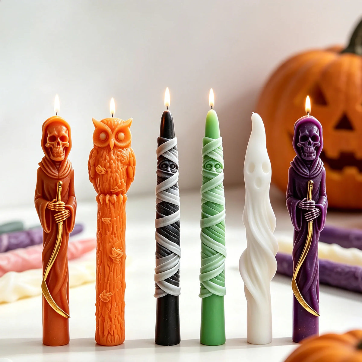Halloween taper candles in mummy ghost Grim Reaper and owl designs