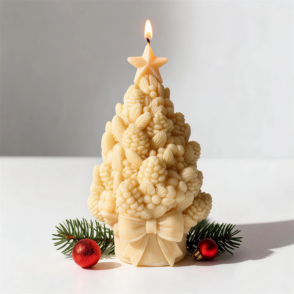 Botanical Christmas tree candle with large decorative bow at the base