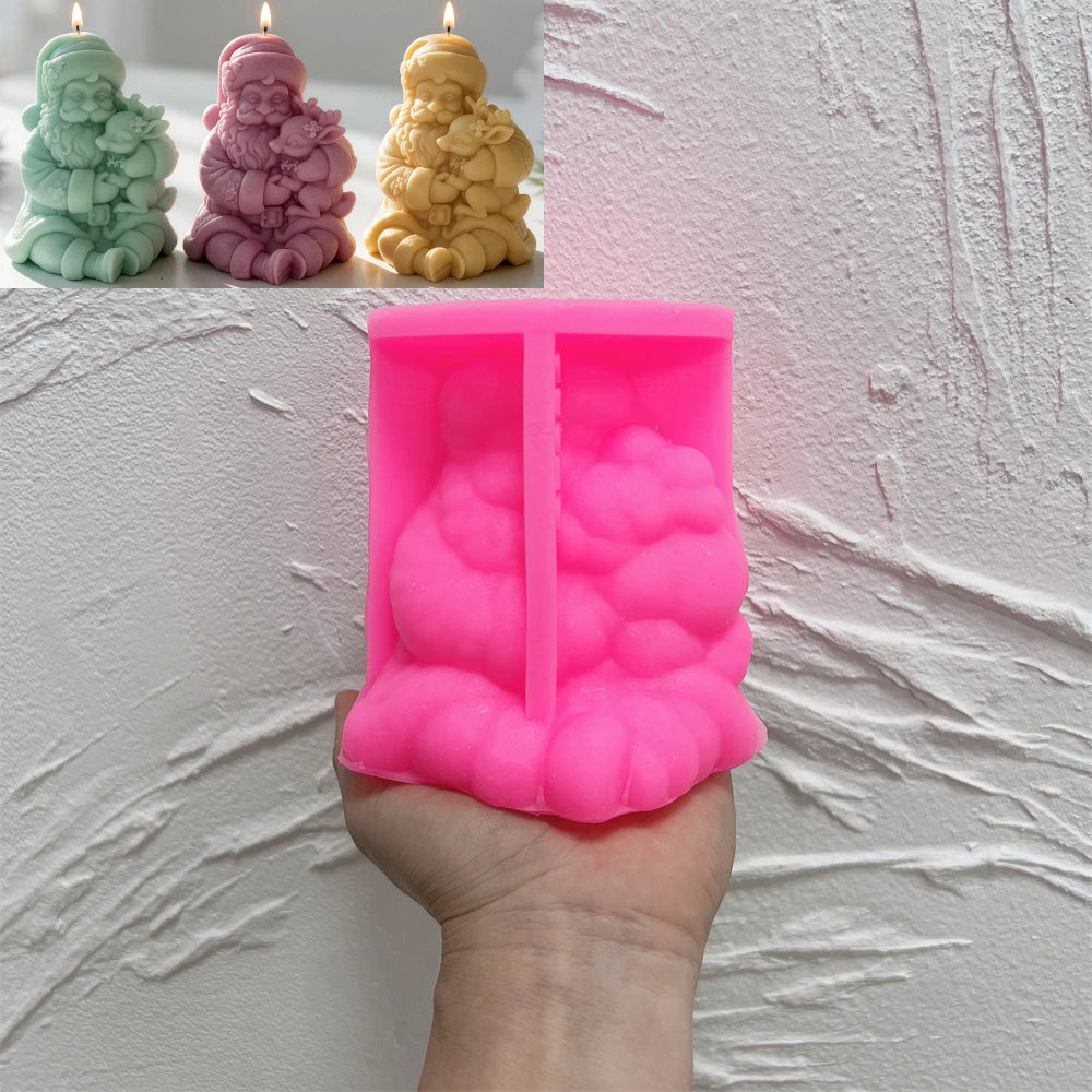 Pink silicone mold for seated Santa holding reindeer candle