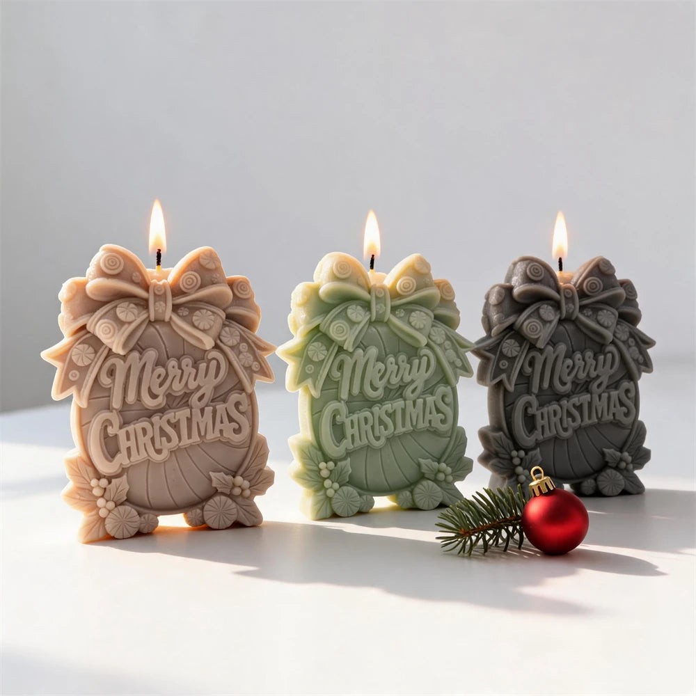 Christmas message candle with ribbed centre bow leaves and berries