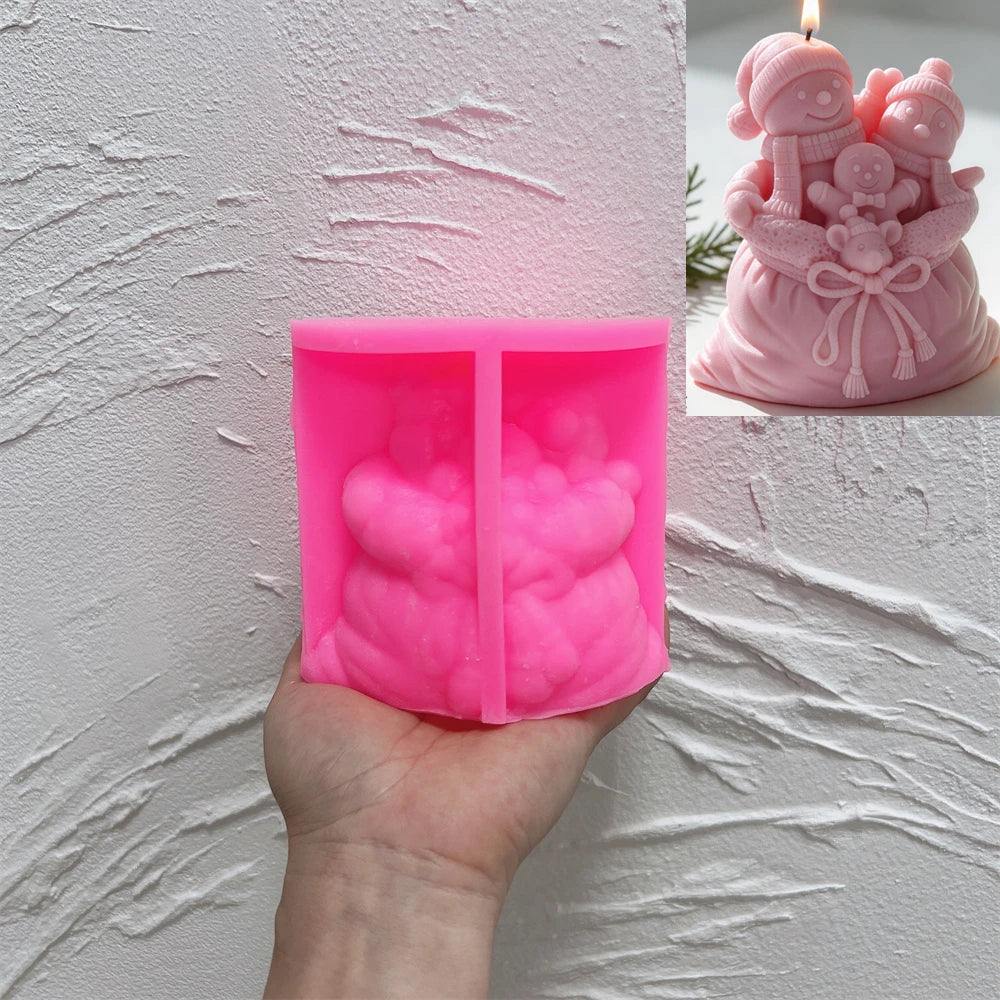 Pink silicone mold for detailed snowman and gingerbread gift sack candle