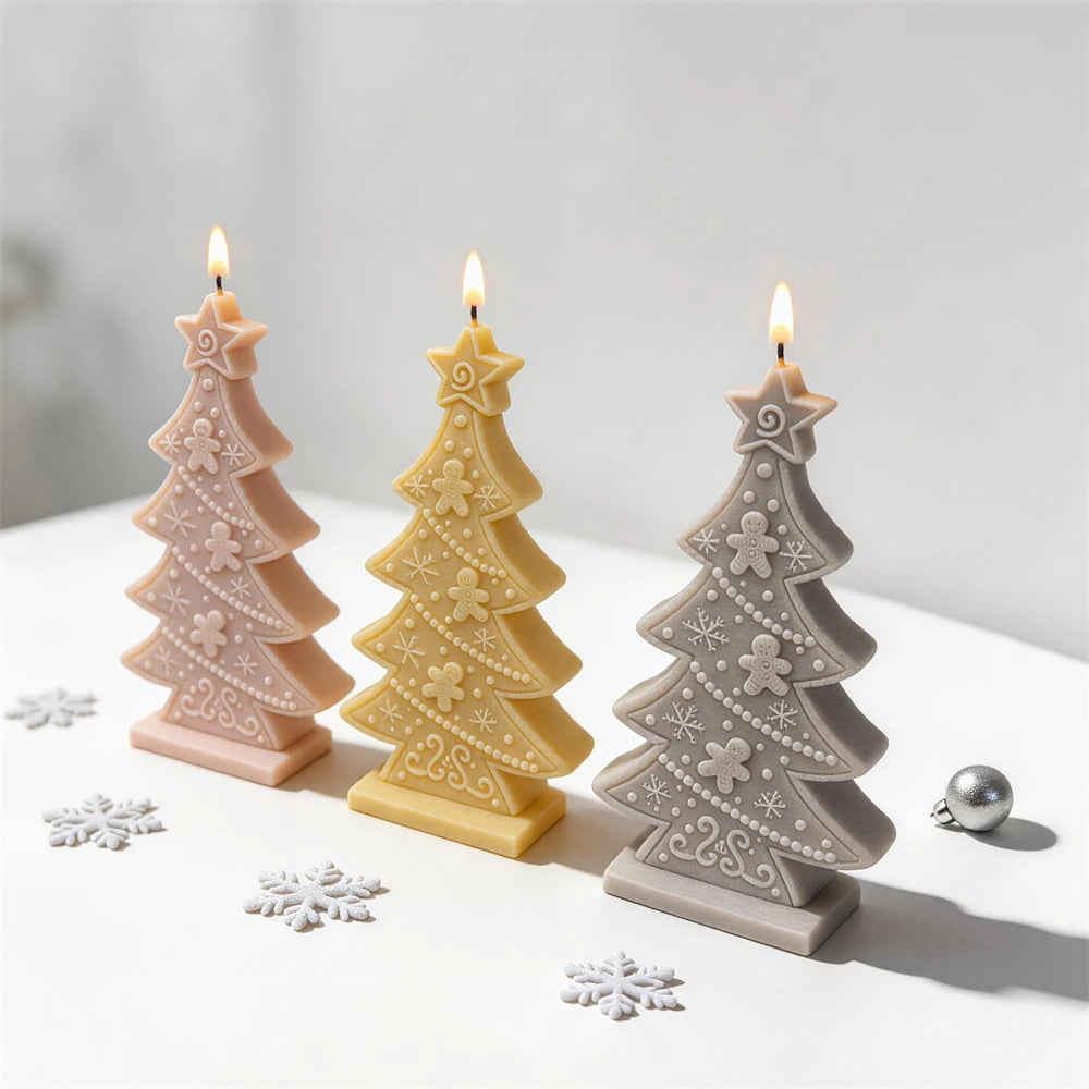 Slim gingerbread tree candle with raised snowflakes scrollwork and cookie figures