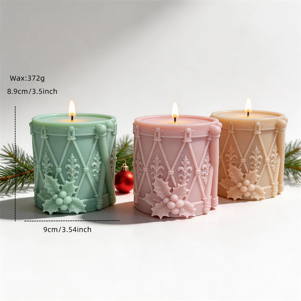 Christmas drum candle measuring 8.9 centimetres tall and 9 centimetres wide