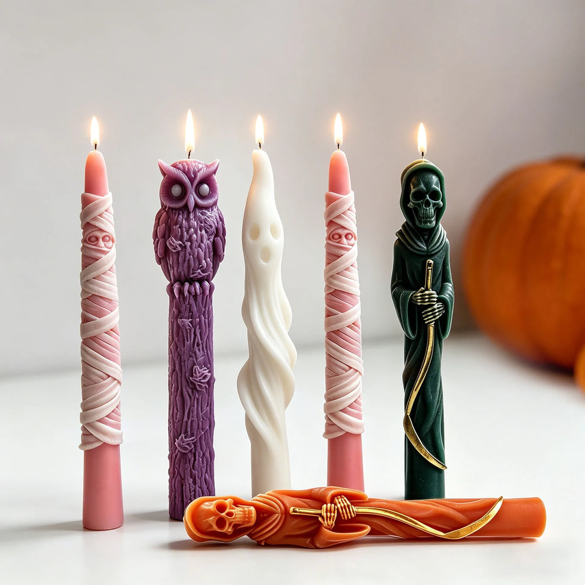 Halloween taper candles in mummy ghost Grim Reaper and owl designs