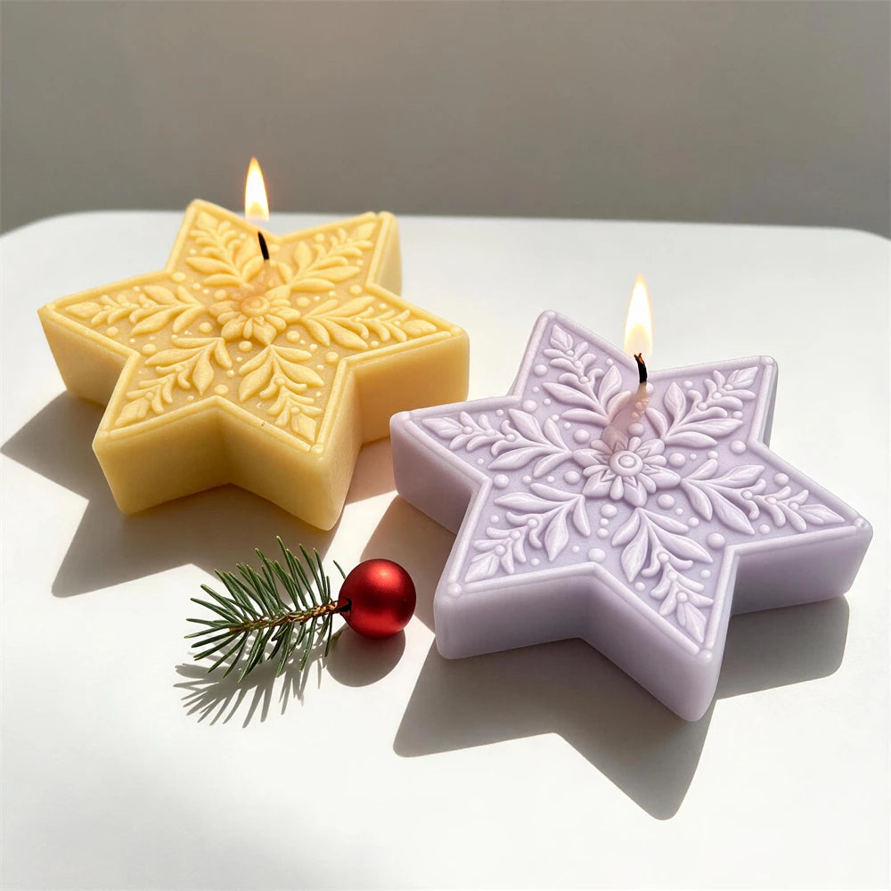 Ornate snowflake star candles with detailed six-point winter patterns