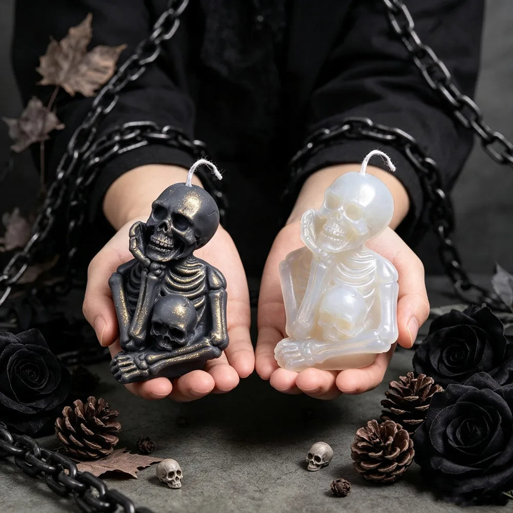Skeleton candle sitting and holding a second human skull
