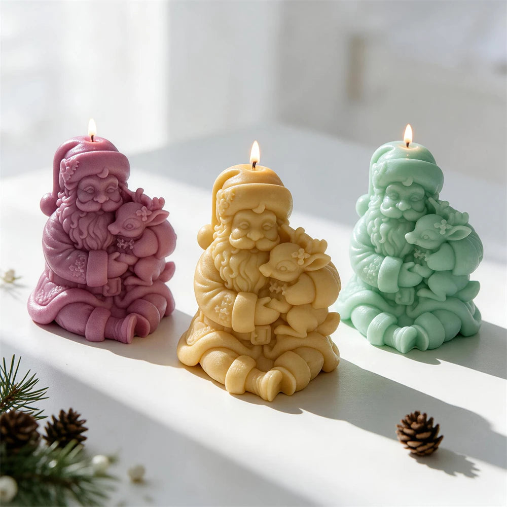Seated Father Christmas candle with reindeer in his arms