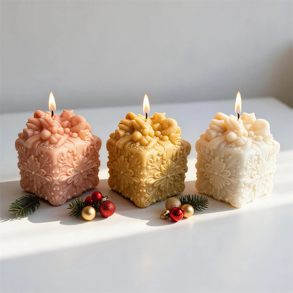 Square Christmas gift candle with snowflakes scrollwork and bow topper