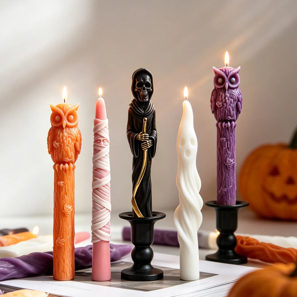 Halloween taper candles in mummy ghost Grim Reaper and owl designs